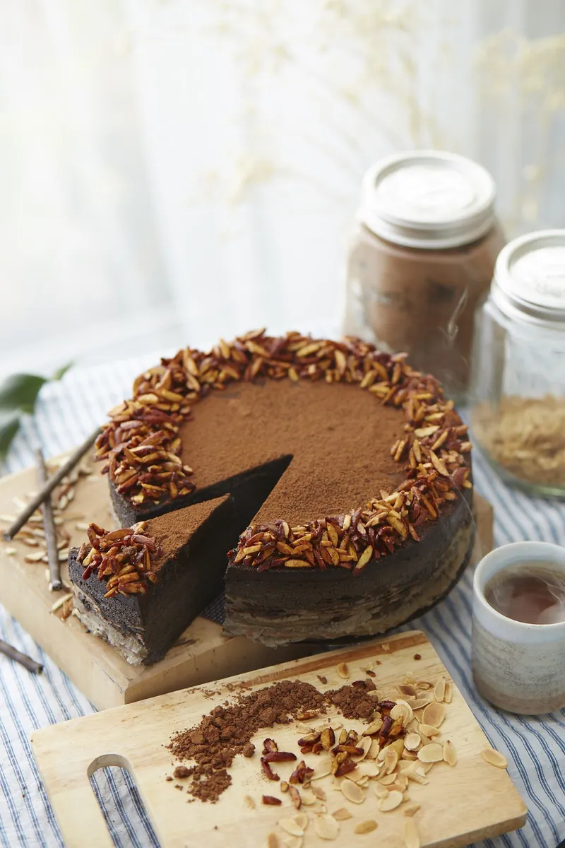 Chocolate cake with almonds and baking ingredients
